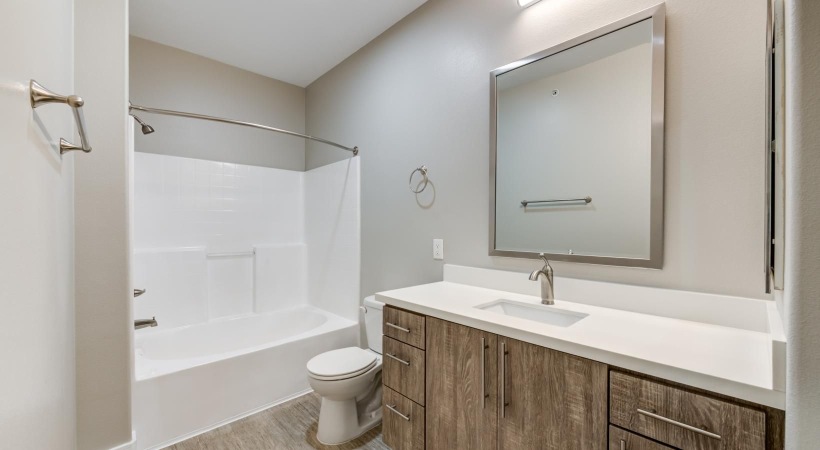 Spacious bathrooms with everything you need a bathroom with a tub sink and toilet