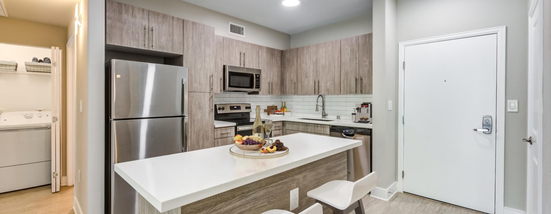 a kitchen with a table and chairs